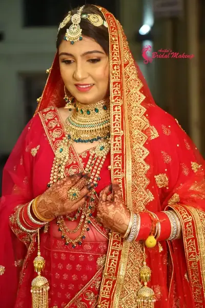 North Indian bride in Mumbai wearing a lehenga and maang tikka
