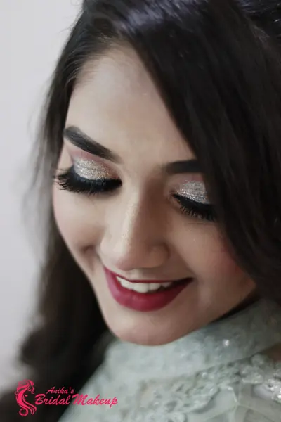 Glam wedding look with winged liner and a bold lip